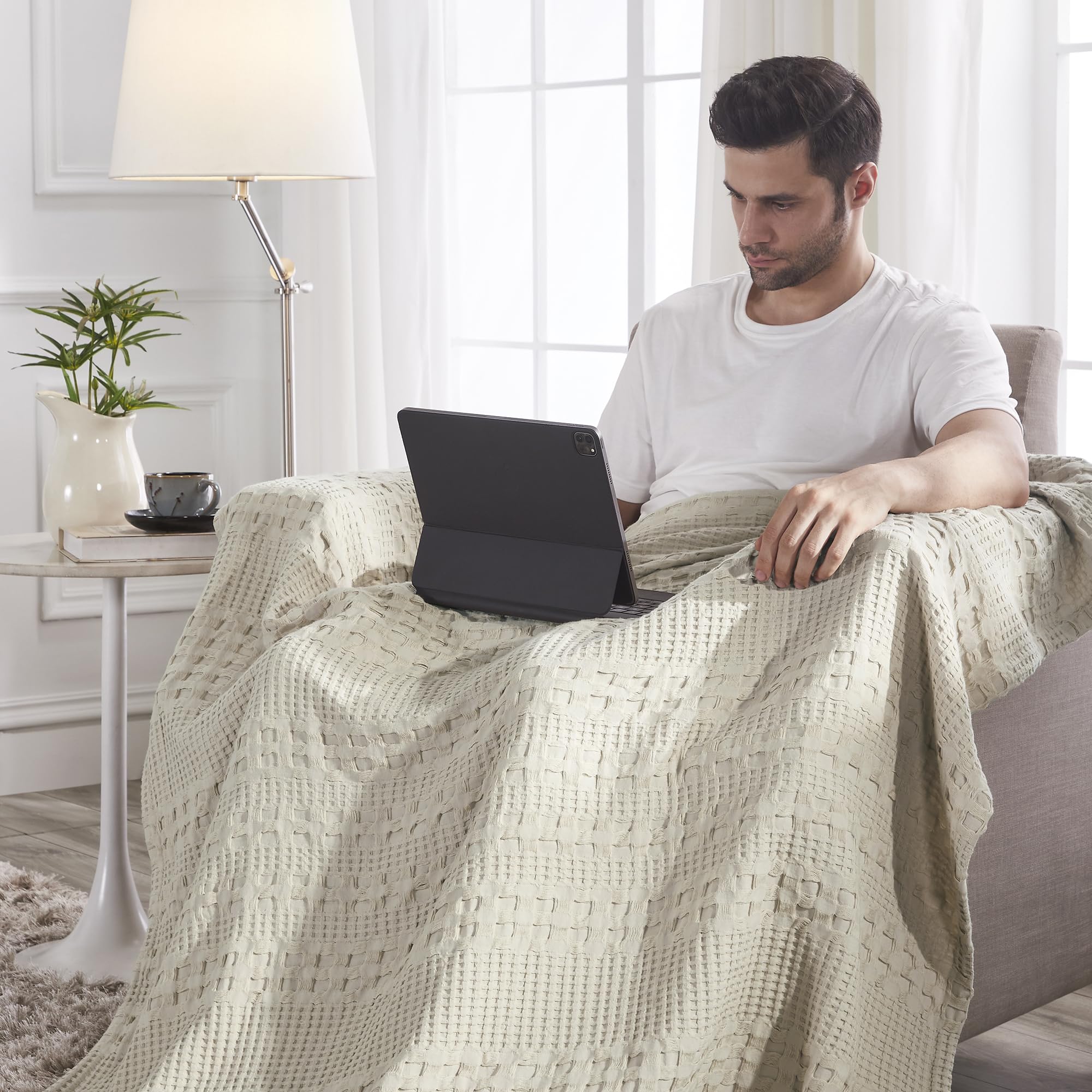 VHC Brands folded throw stack demonstrating compact storage and travel-ready convenience