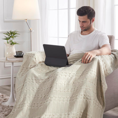 VHC Brands folded throw stack demonstrating compact storage and travel-ready convenience