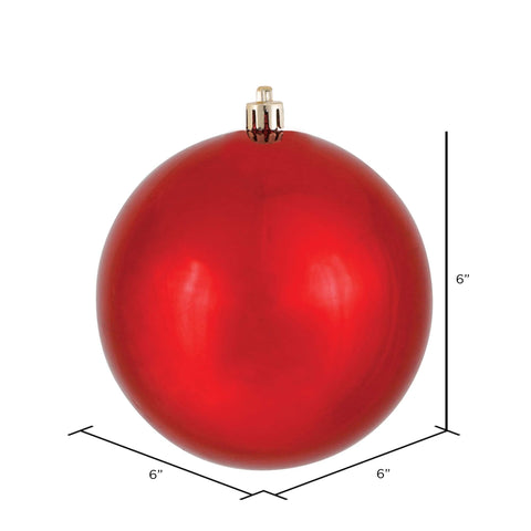 Vickerman ornament hanging on decorated tree adding vibrant red focal color