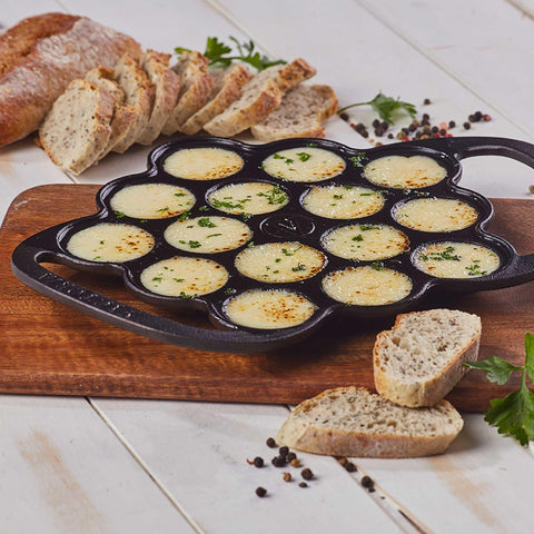 Victoria pan beside spoon showing size comparison for portion control and batter amount