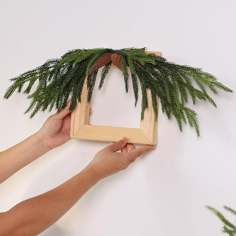 VIERENA branches arranged on mantel giving cozy festive ambiance
