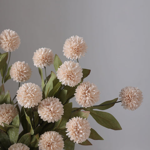 VIERENA neutral beige pompon mums used as a low table centerpiece accent