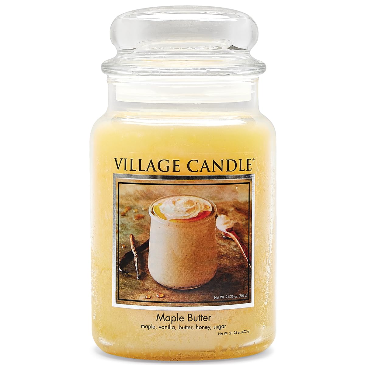 Village Candle front view of apothecary jar showing warm yellow hue and decorative appeal