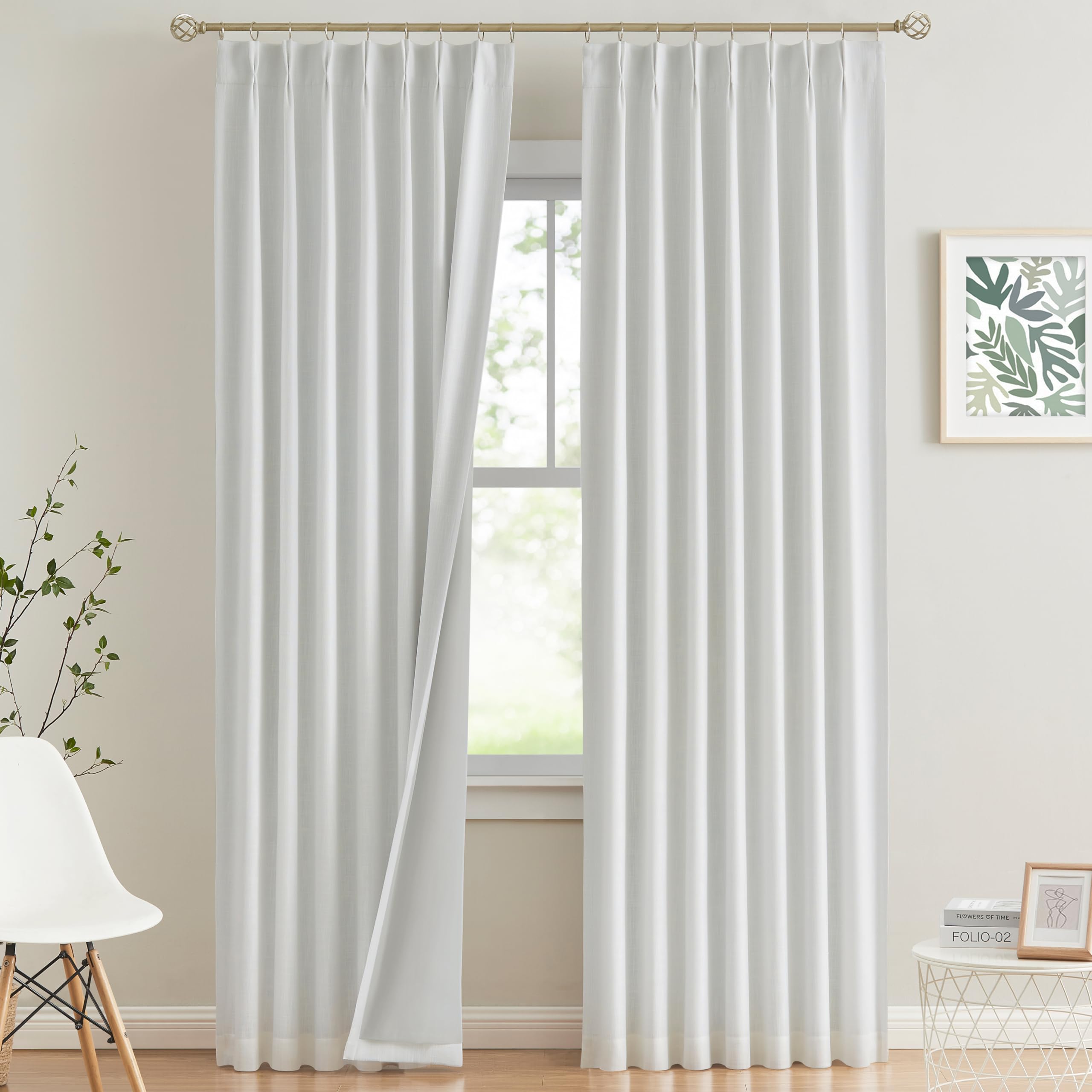 Vision Home front view of two white pinch pleat panels showing tailored look and benefit