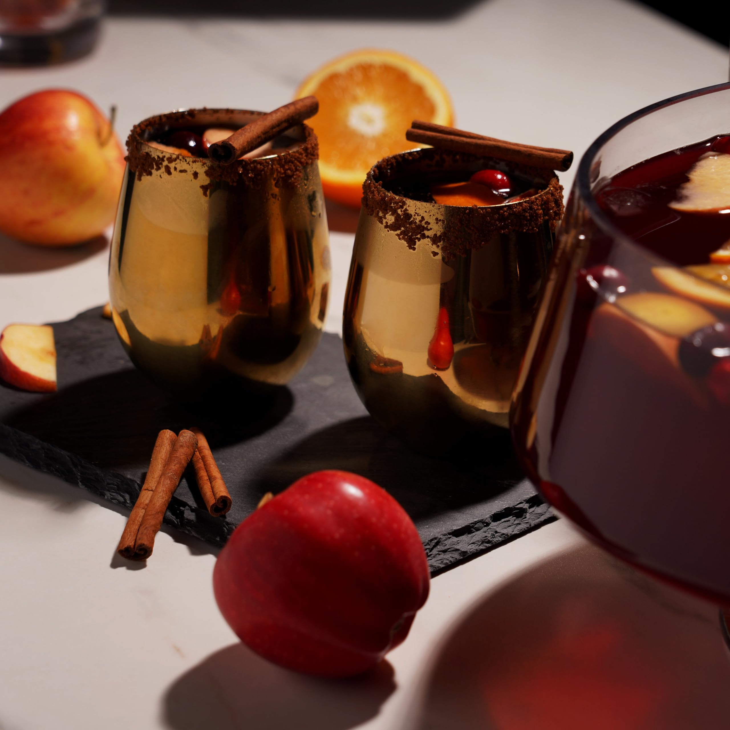 Viski pouring red wine into gold tumbler demonstrating enhanced presentation