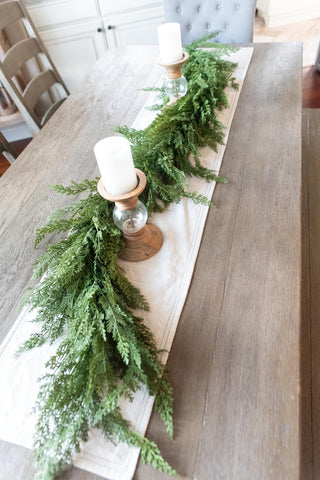 Vita Domi garland draped on a mantel adding instant seasonal warmth and polish