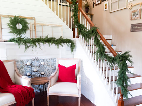 Vita Domi garland in cozy fireplace setting creating inviting seasonal atmosphere