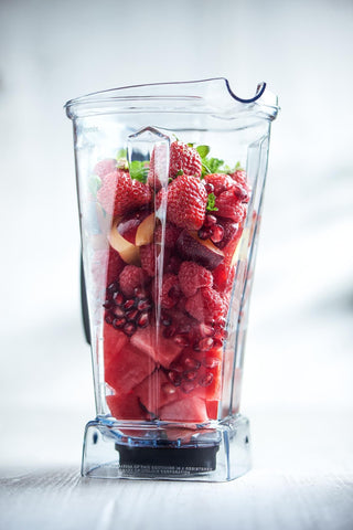 Vitamix 15856 pouring smoothie into glass demonstrating efficient, drip-free spout