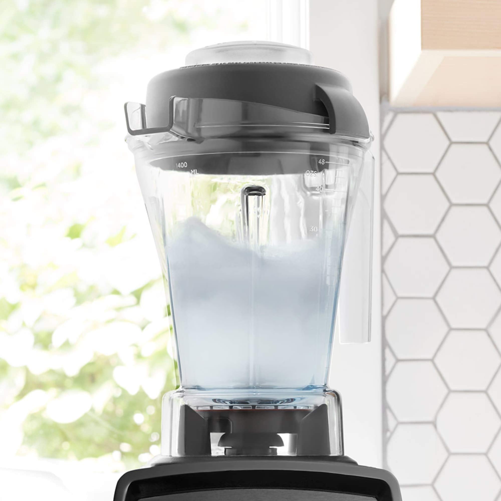Vitamix container in kitchen lifestyle showing compact storage benefit
