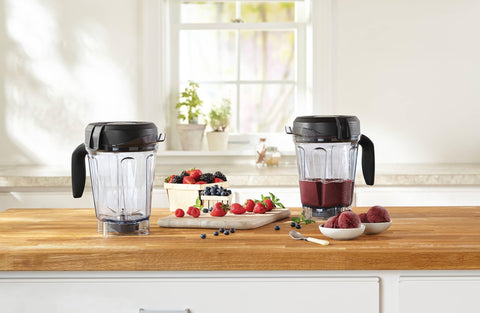 Vitamix soft-grip handle pouring smoothie with steady control benefit