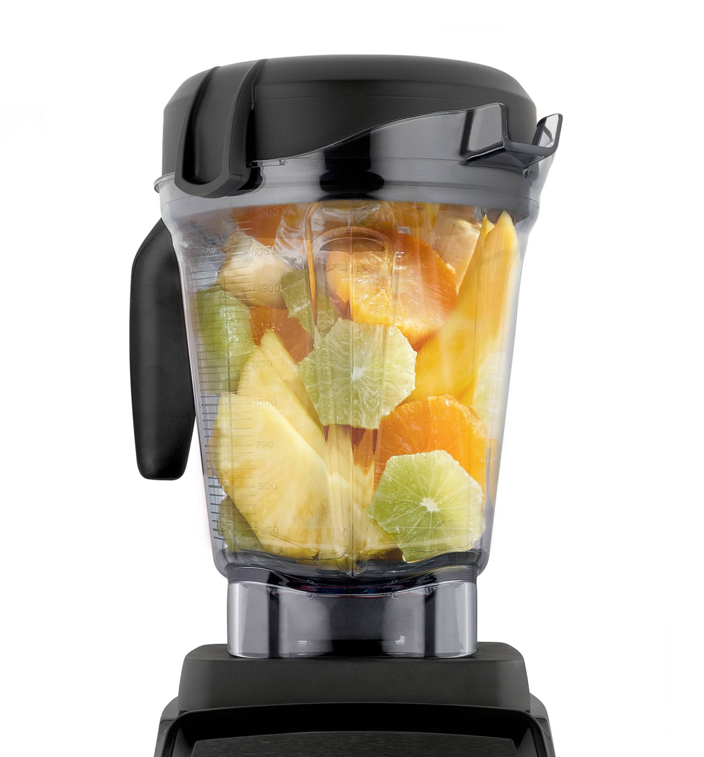 Vitamix top opening and lid plug visible for tamper access and easy additions