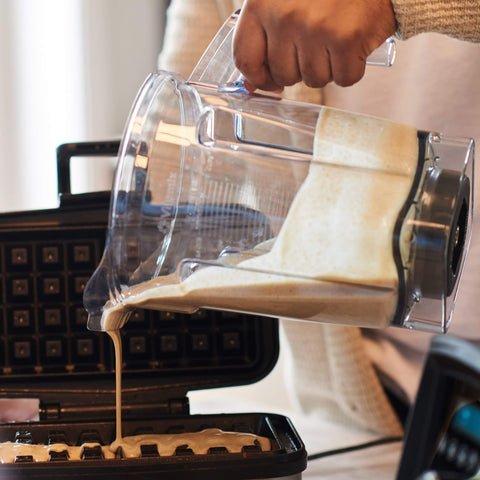 Vitamix blending in a kitchen setting illustrating large-batch family-serving convenience