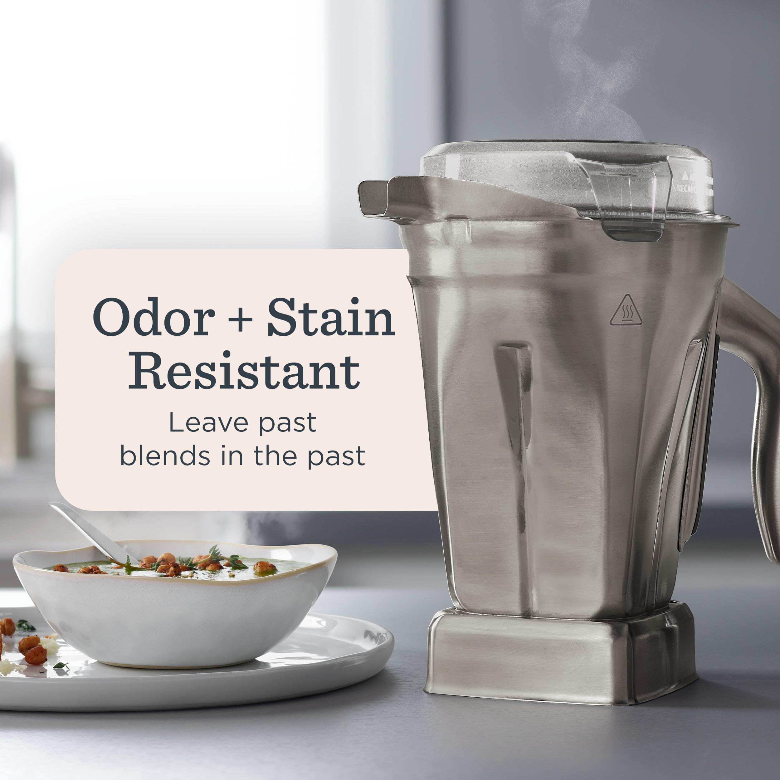 Vitamix low-profile tamper alongside container speeds thick and frozen processing