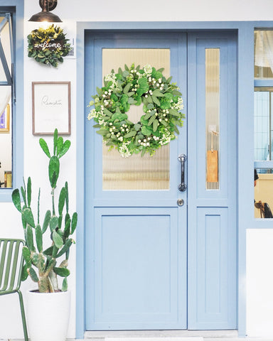 Vlorart wreath on porch creating cozy farmhouse atmosphere