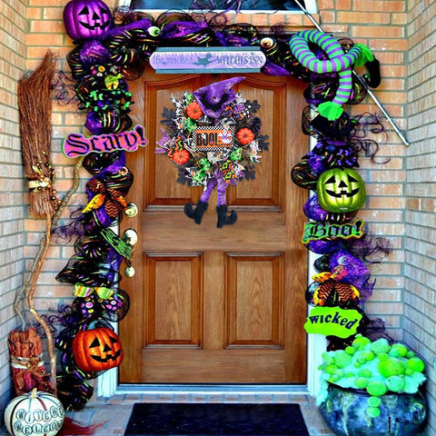 Vofuly wreath styled on mantel for indoor Halloween display and warmth