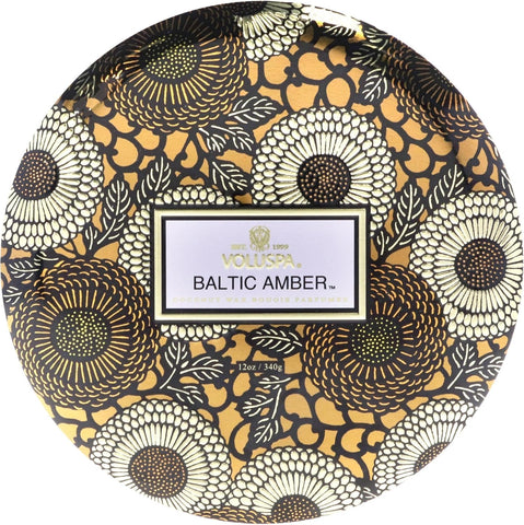 Voluspa Baltic Amber top detail with three lit wicks for even fragrance diffusion