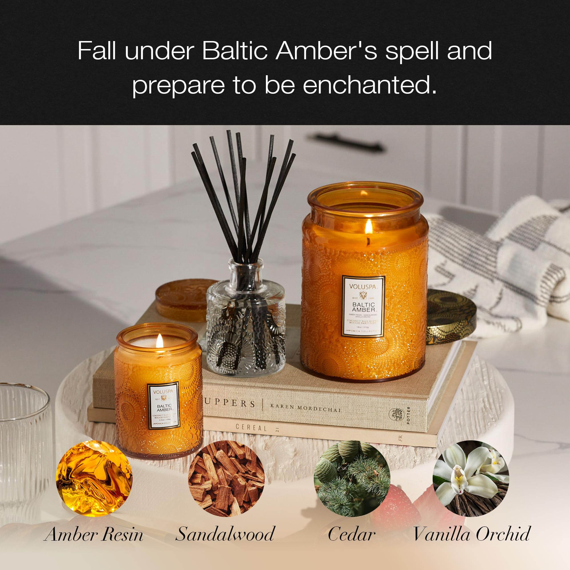 Voluspa Baltic Amber lit candle in living room, creates warm ambient atmosphere