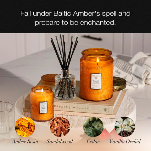 Voluspa Baltic Amber lit candle in living room, creates warm ambient atmosphere