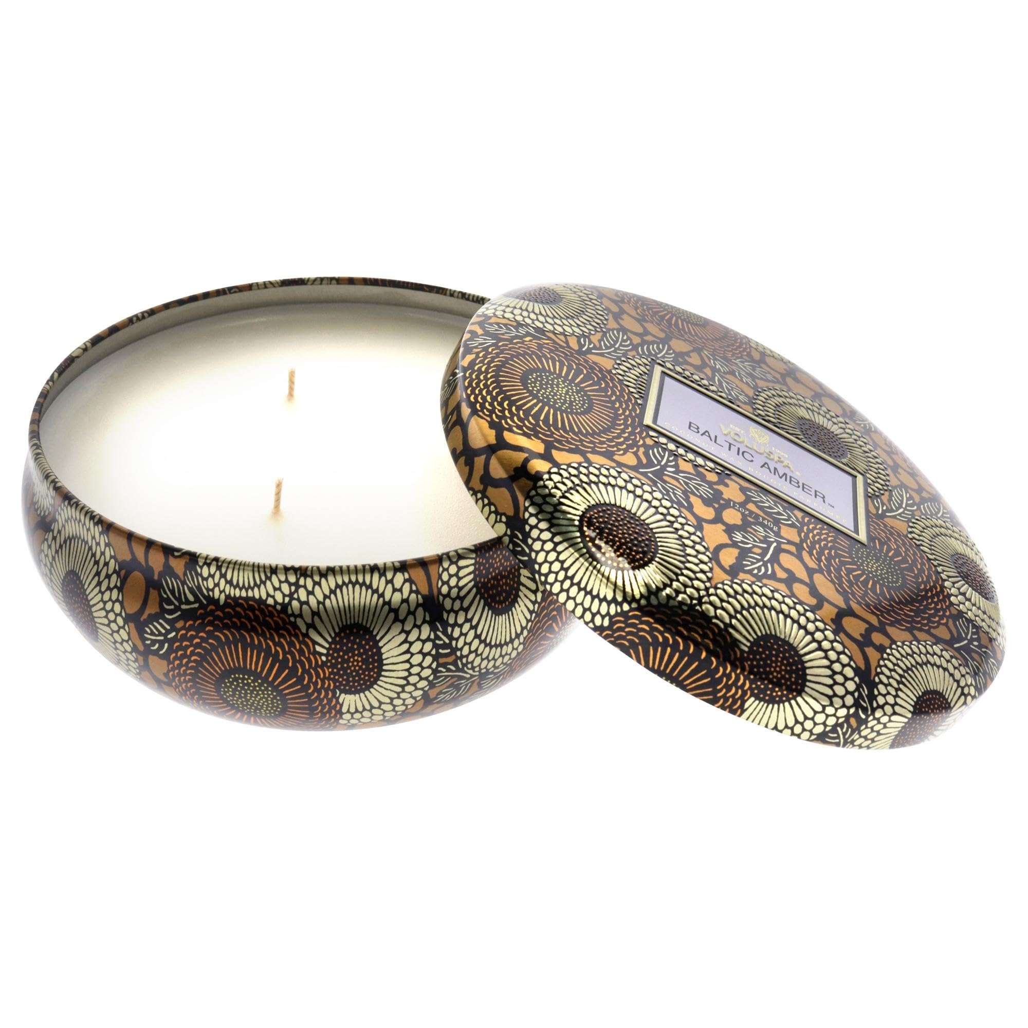 Voluspa Baltic Amber candle styled on a living room shelf adding warm ambiance