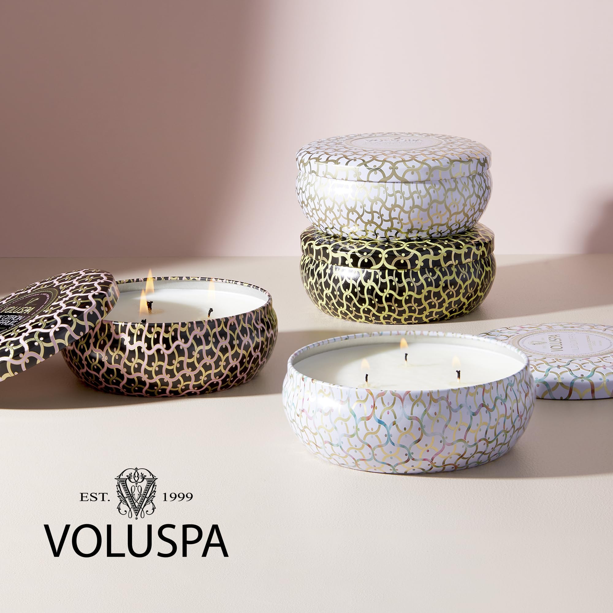 Voluspa Baltic Amber held by hand showing 12 oz scale and portable convenience