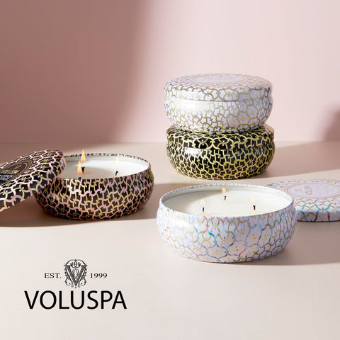 Voluspa Baltic Amber held by hand showing 12 oz scale and portable convenience