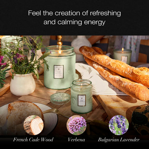Voluspa candle lit in living room creating calm ambient fragrance