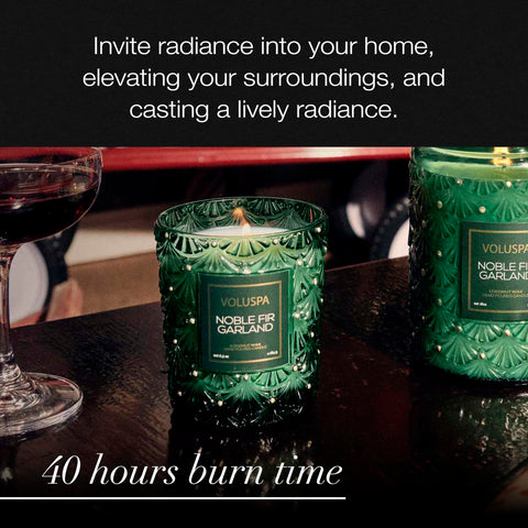 Voluspa candle next to a coffee mug demonstrates compact 6.5 oz size