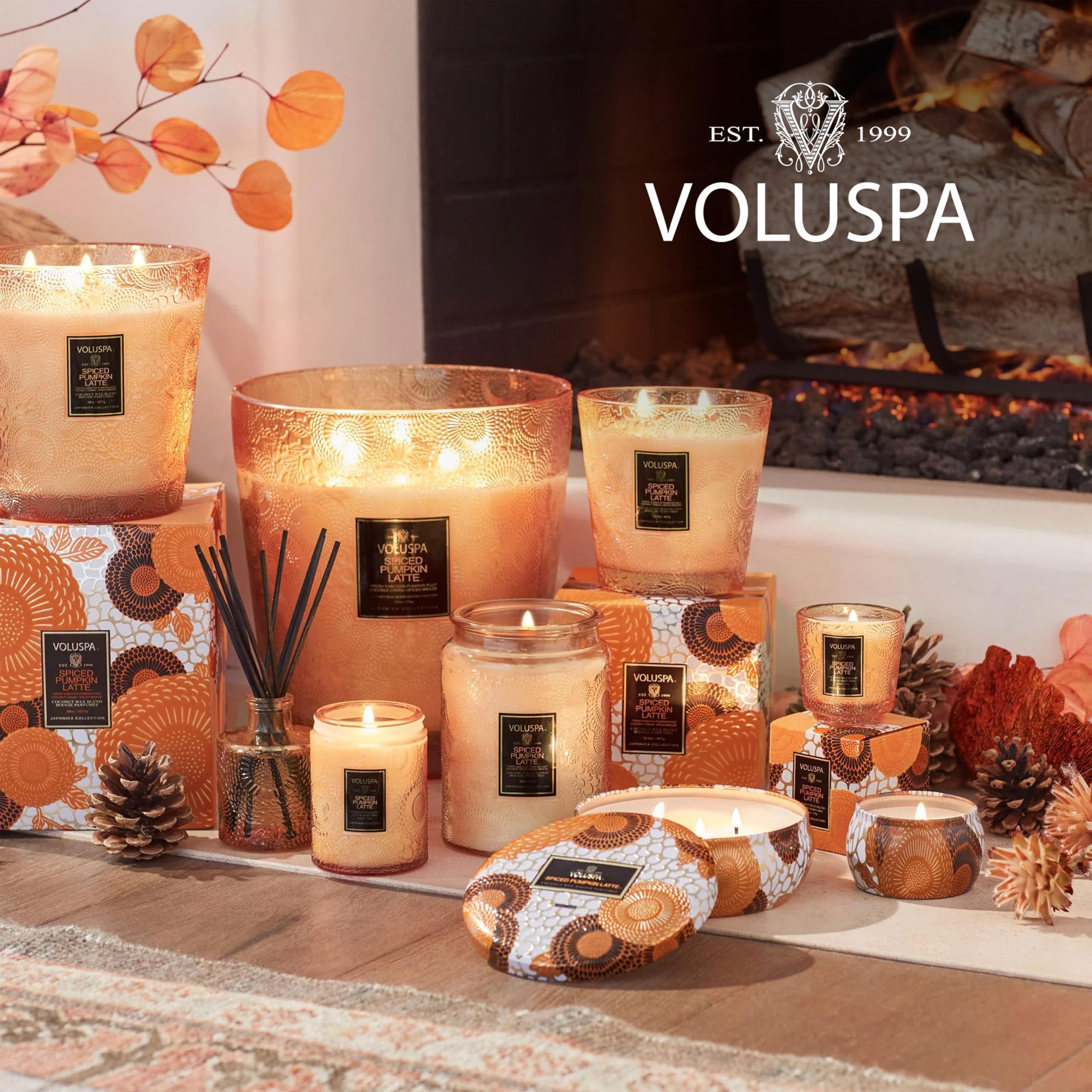 Voluspa spiced pumpkin latte beside a coffee mug size comparison illustrating portable convenience