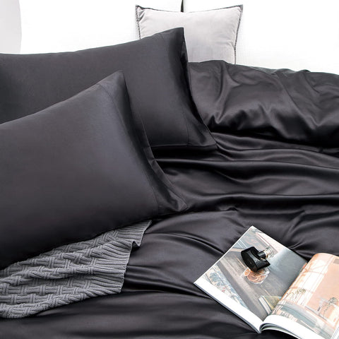 Vonty styled bed with black satin sheets showing elegant look benefit