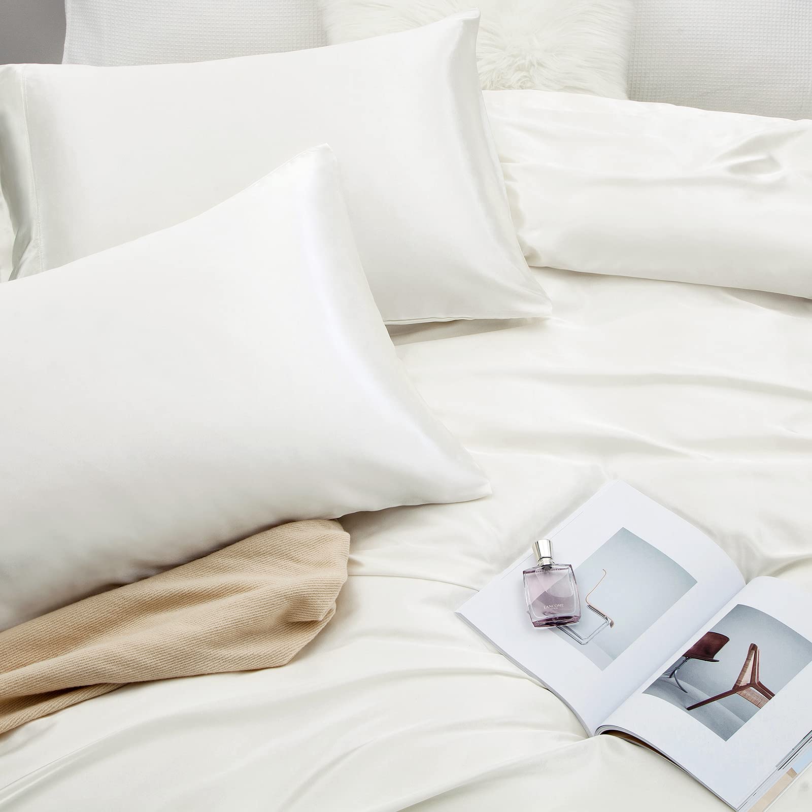 Vonty satin sheets styled on bed conveying elegant bedroom upgrade