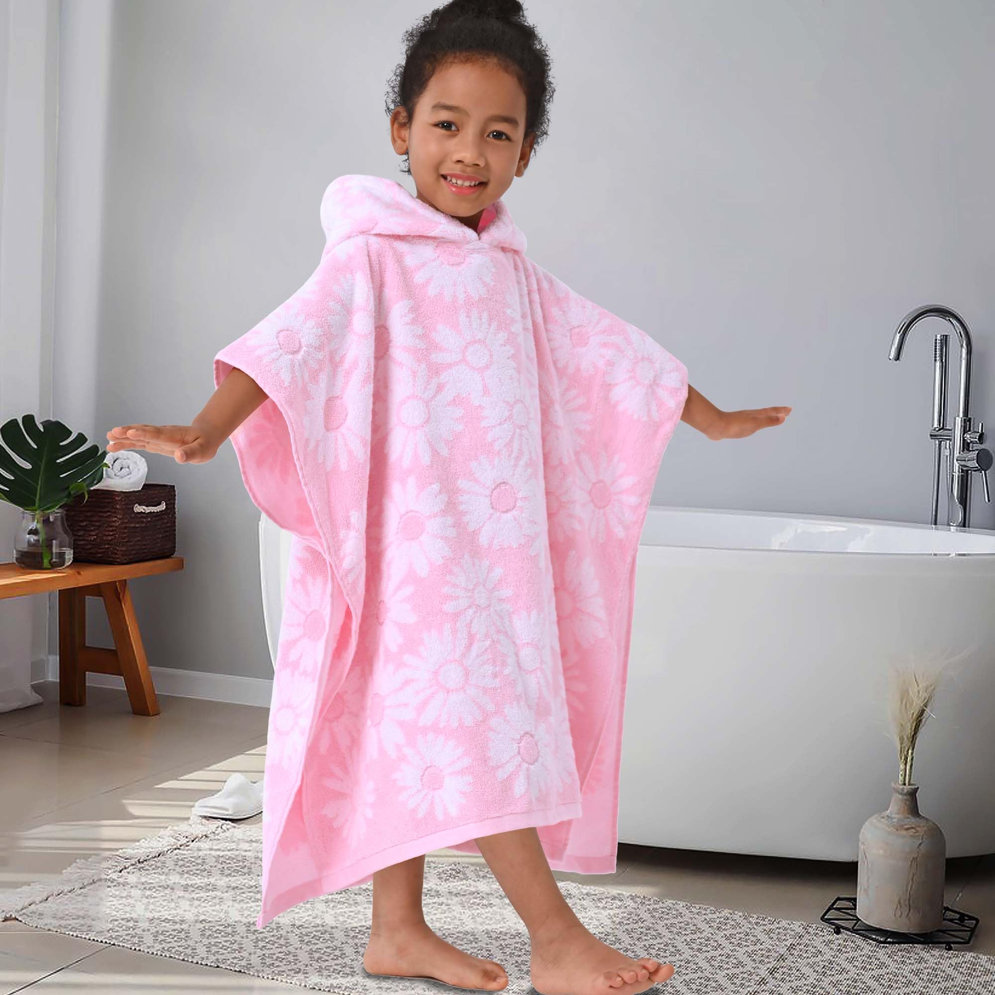 VOOVA & MOVAS child wearing poncho at beach for easy changing and warmth