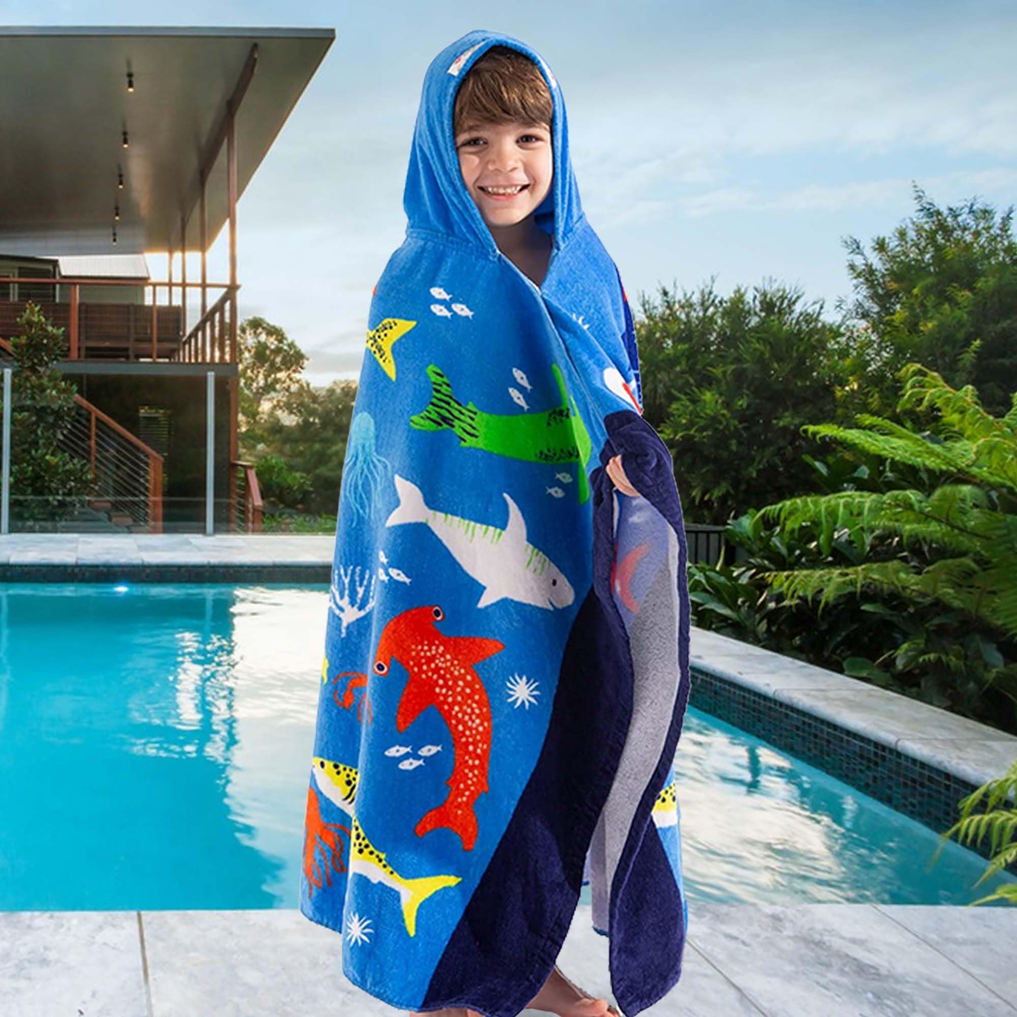 VOOVA & MOVAS child wearing towel poolside for quick dry after swim