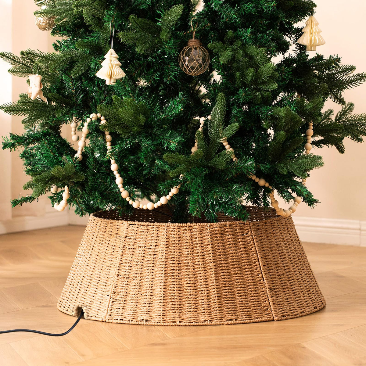 Voplintra front view of wicker tree collar hides tree base and adds rustic charm