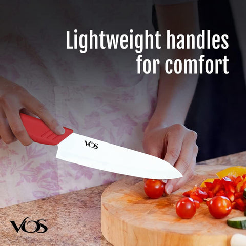 Vos knives on cutting board with fruit for clear size and scale