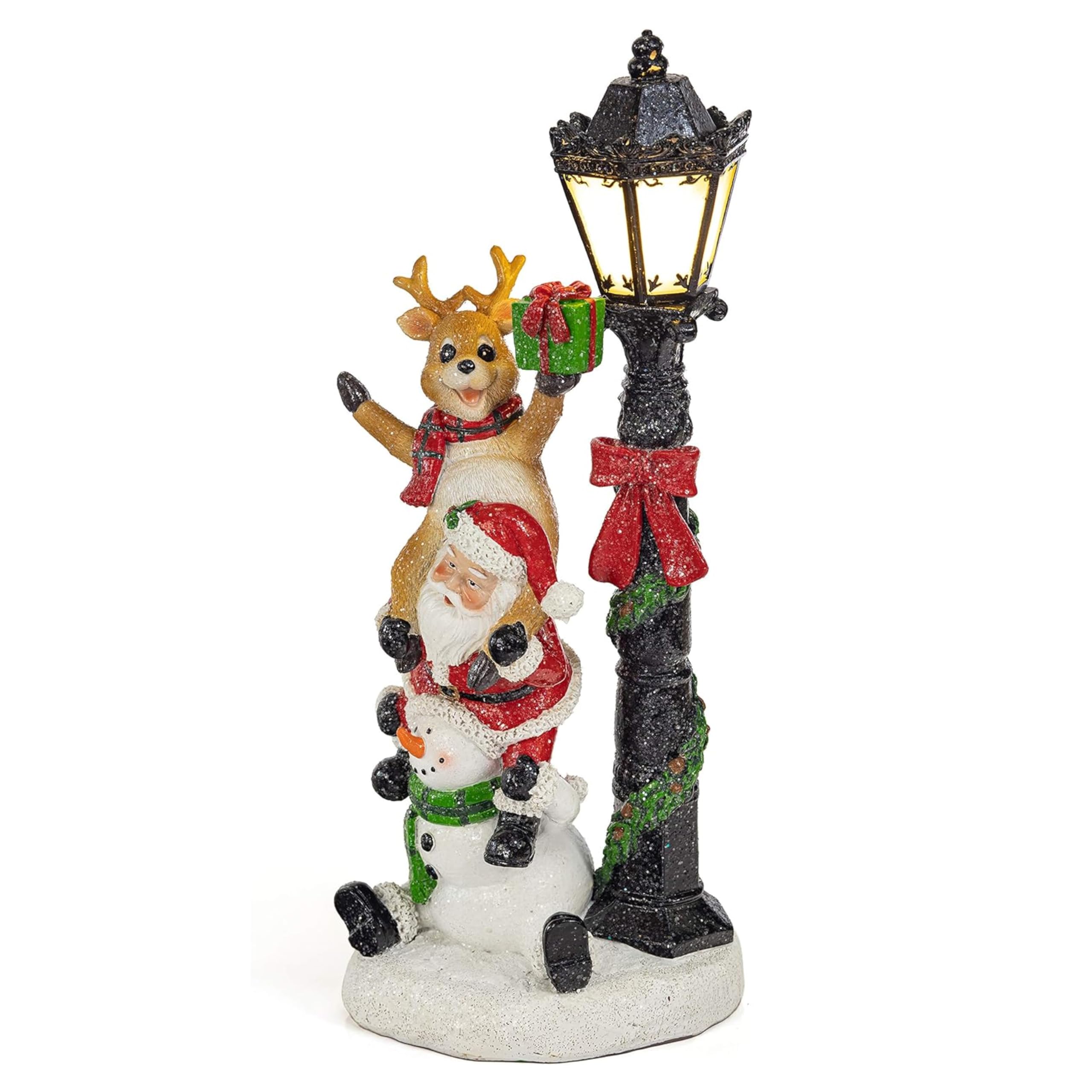 VP Home front view of light-up Santa trio glowing on shelf for festive ambiance