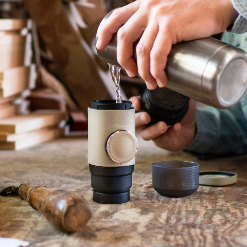 WACACO Minipresso NS2 piston detail highlighting manual pump for pressurized espresso extraction