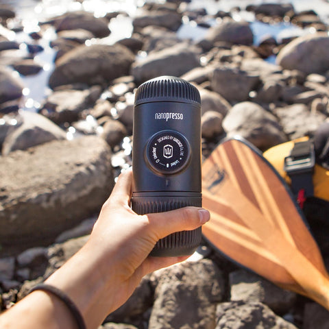 WACACO Nanopresso held in hand to show compact 15.6 cm length and 336 g lightweight design