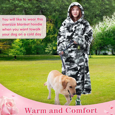 Waitu wearable blanket in use outdoors on a campsite providing portable warmth