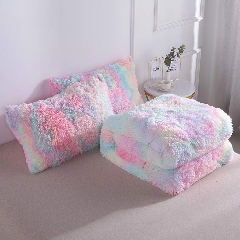 Wajade comforter beside sofa for scale showing full/queen fit clarity