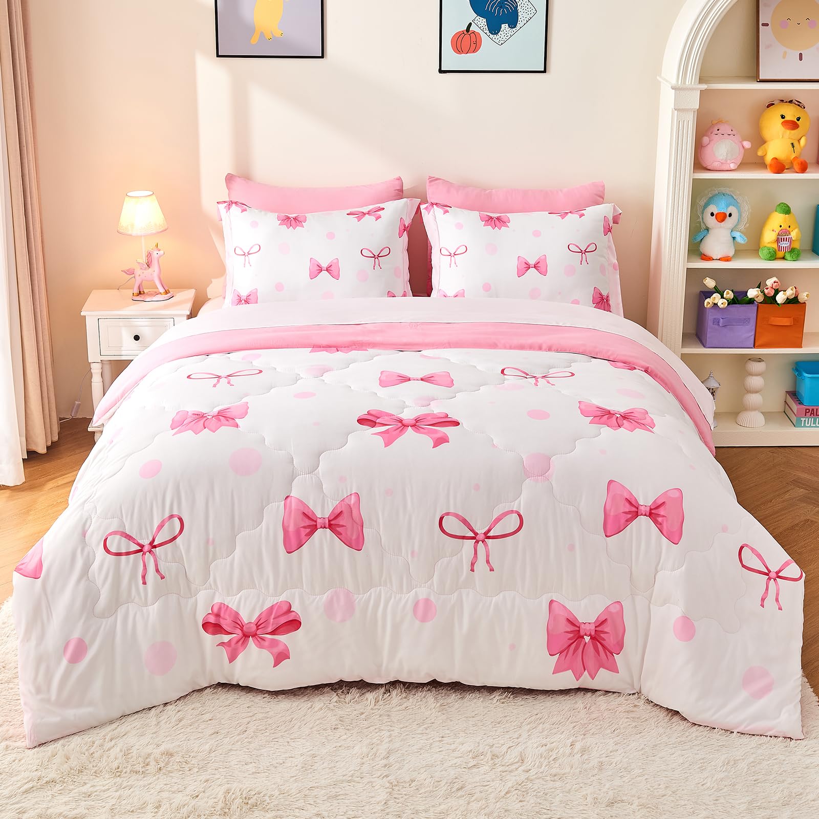 Wajade comforter front view showing pink bow print and cozy look