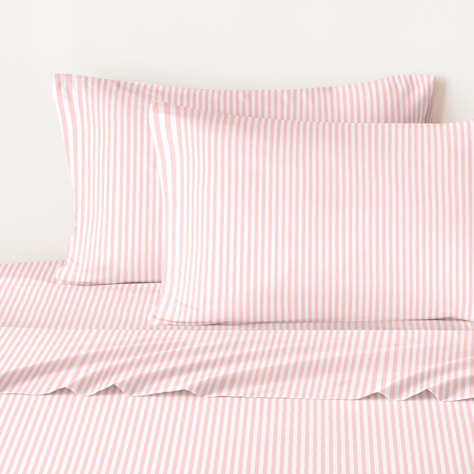 Wake In Cloud styled bedroom with pink white stripes adding farmhouse charm and easy refresh benefit