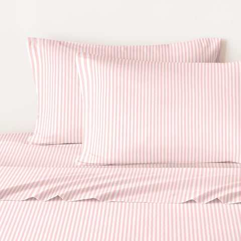 Wake In Cloud styled bedroom with pink white stripes adding farmhouse charm and easy refresh benefit