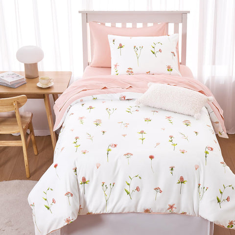 Wake In Cloud comforter on a styled Twin bed showing floral pattern and inviting bedroom aesthetic