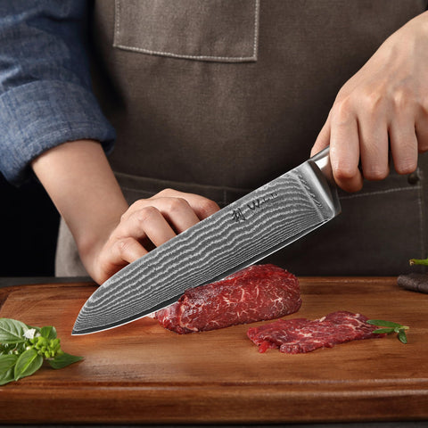 Wakoli small santoku held in hand demonstrating balanced control and comfort