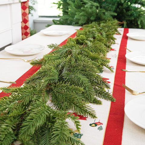 Watayo garland wrapped around stair rail demonstrating easy styling
