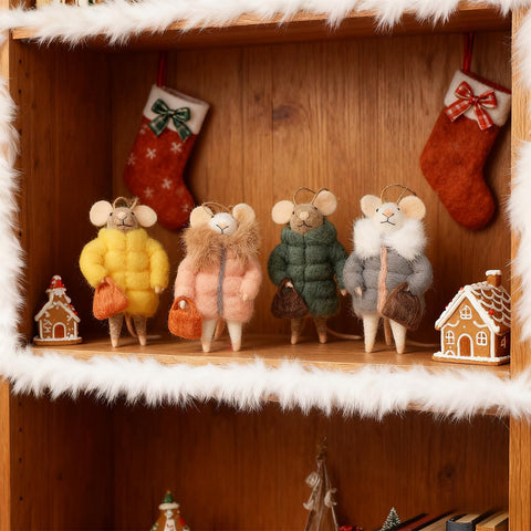 Watereem mice hanging on a Christmas tree adding cozy whimsical accents