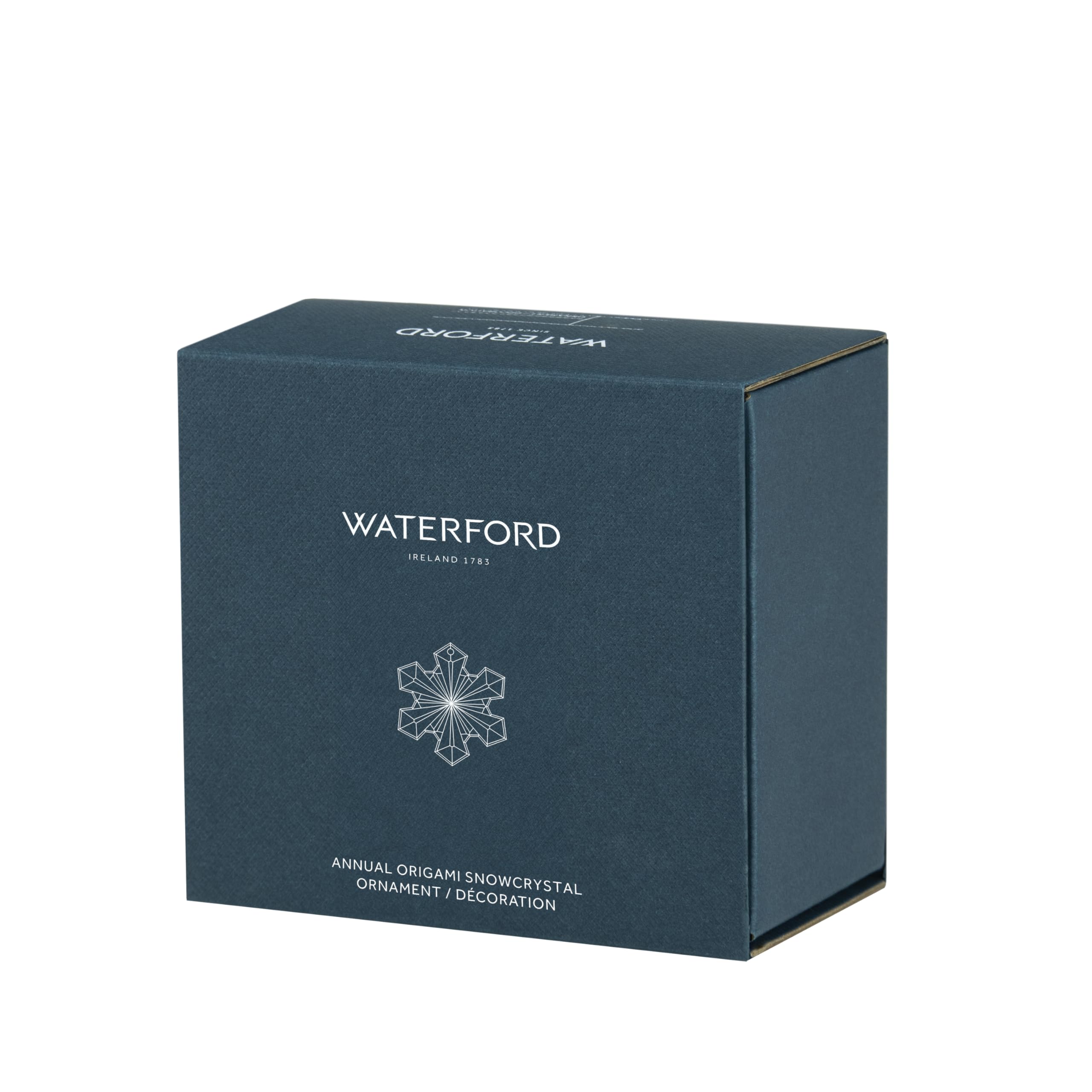 Waterford ornament hanging on a Christmas tree creating radiant reflections and ambiance