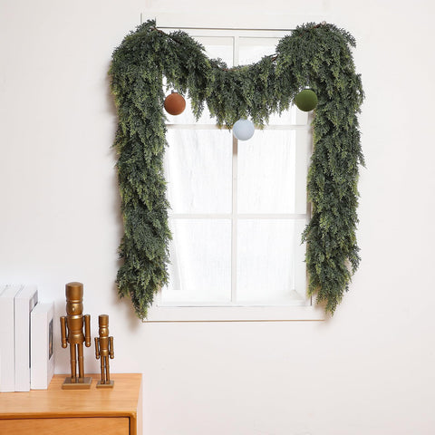 Waydress garland on porch illustrating sheltered outdoor use and curb appeal benefit