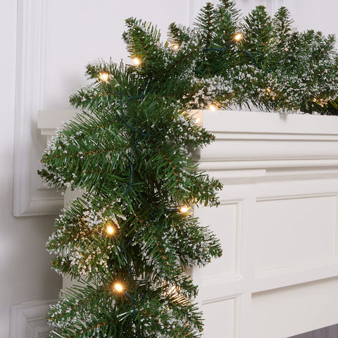 WBHome garland draped on staircase adding elegant holiday charm