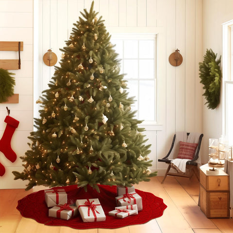 WBHome living room scene with skirt around tree showing warm holiday ambiance